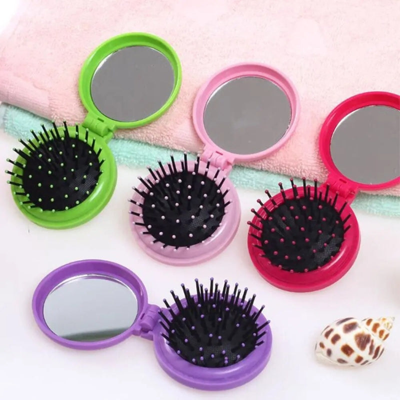 Picots souples de la brosse à cheveux compacte