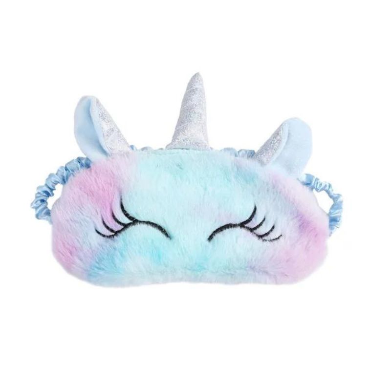 Masque de nuit licorne posé sur un oreiller