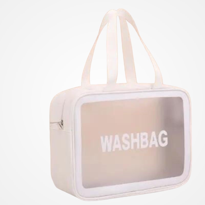 Trousse transparente posée sur un bagage cabine