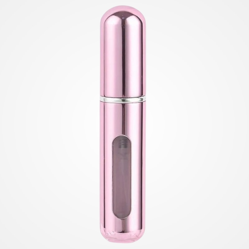 Atomiseur de parfum compact tenu en main