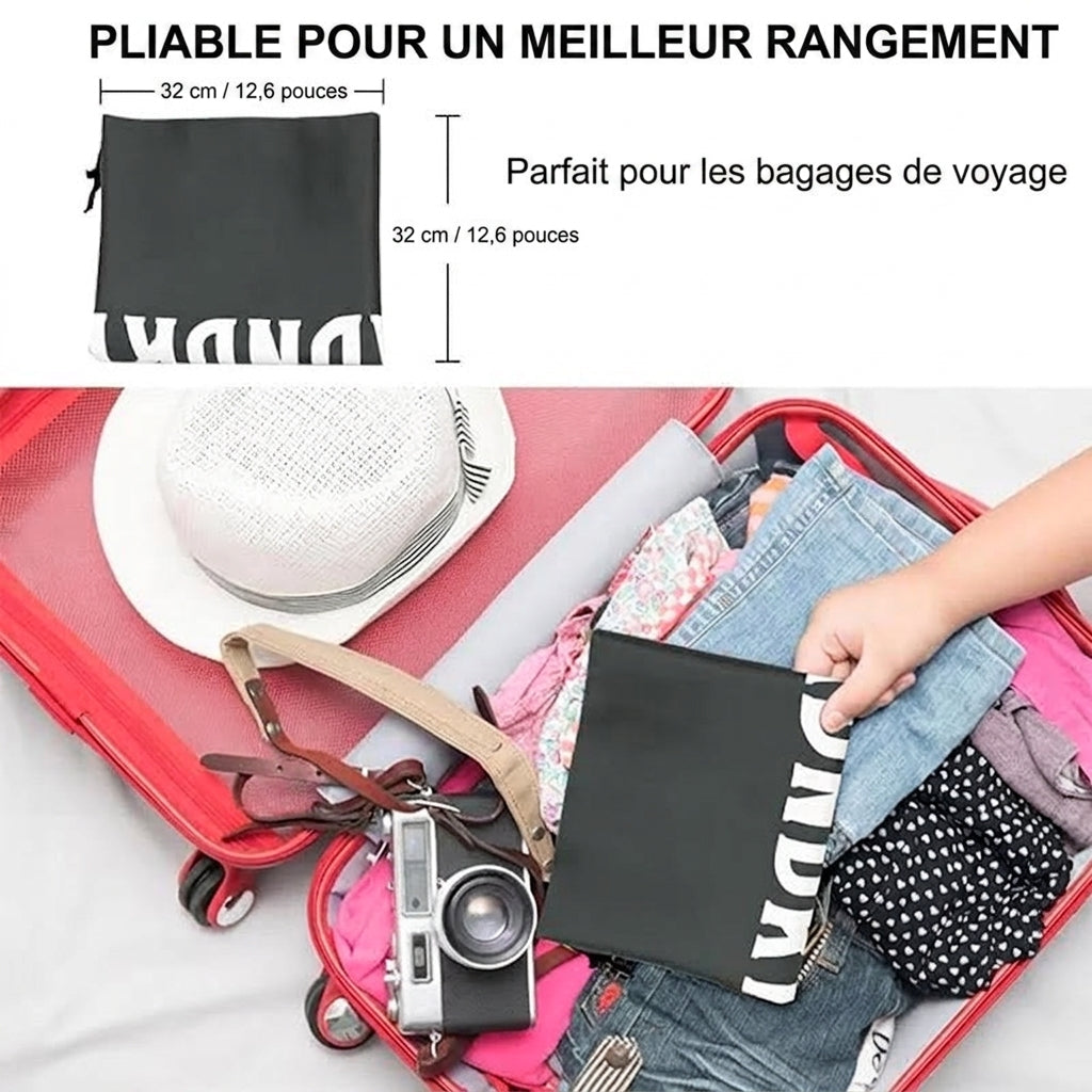 Sac à linge de voyage plié dans une valise