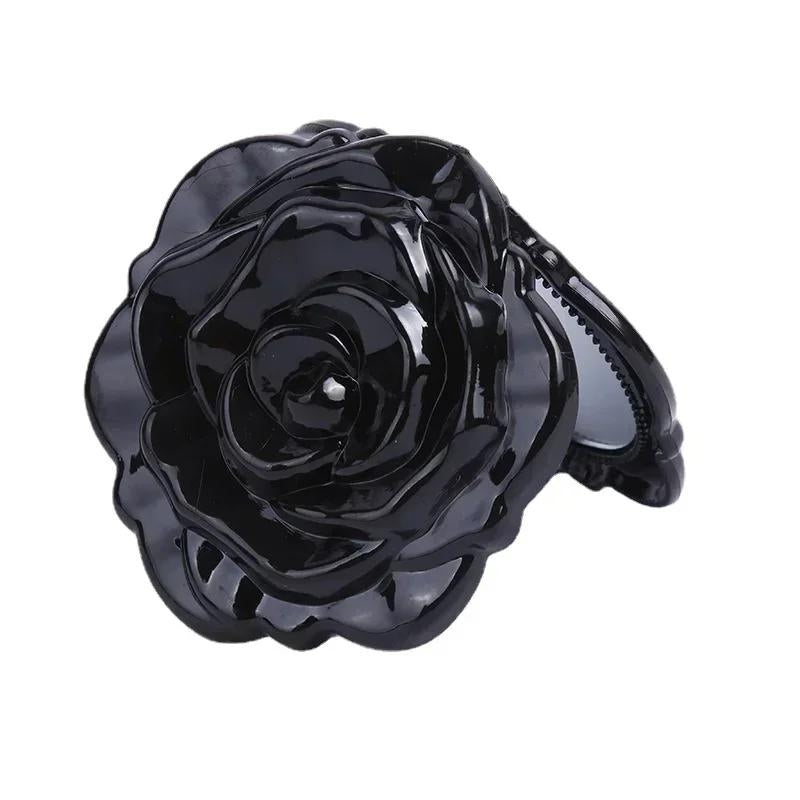 Détail du design floral du miroir de poche