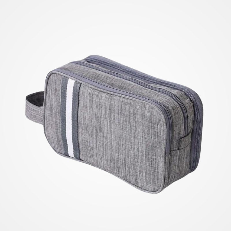 Trousse de toilette compacte posée dans une salle de bain