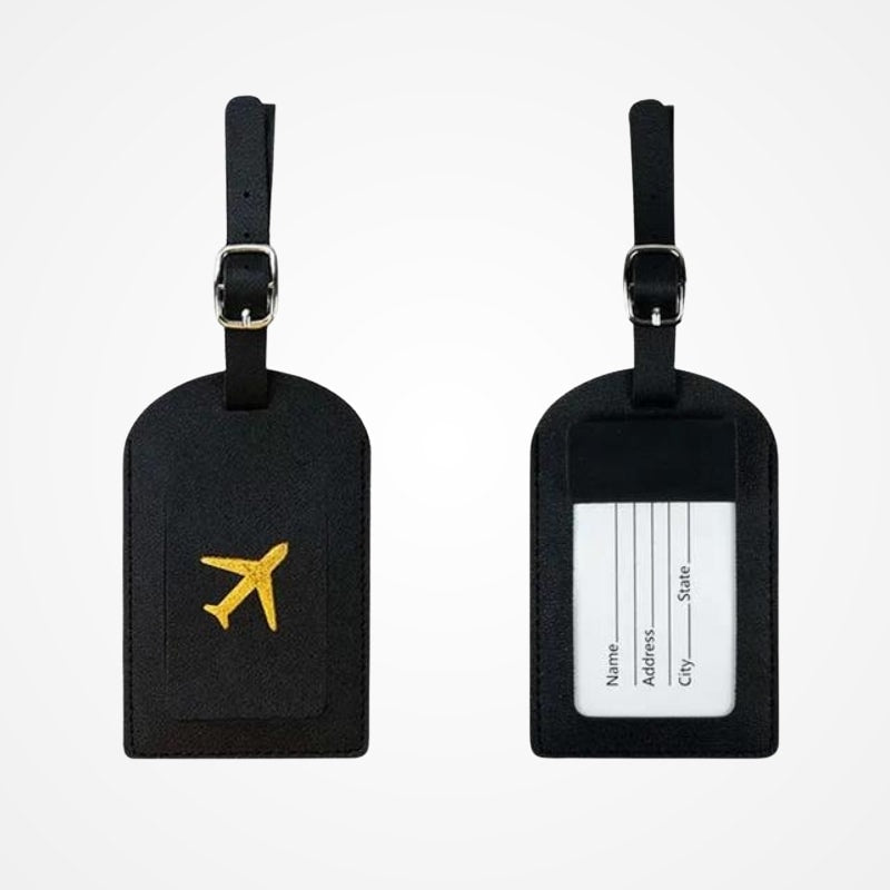 Porte-étiquette de bagage en simili cuir attaché à une valise