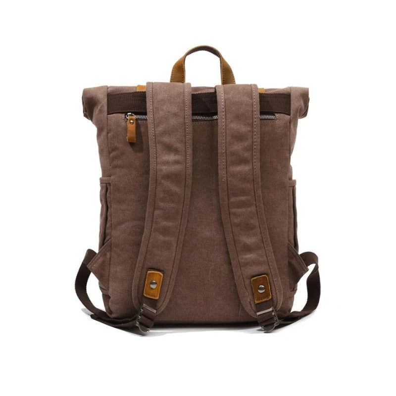 Détail des finitions en cuir du sac à dos toile