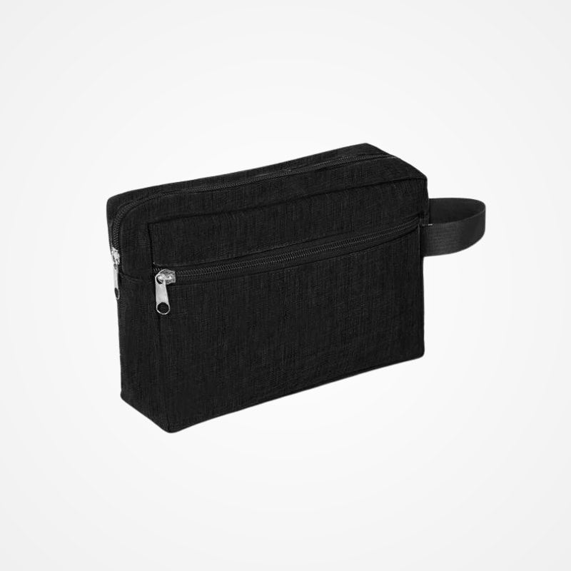 Trousse de toilette personnalisable posée sur une surface claire